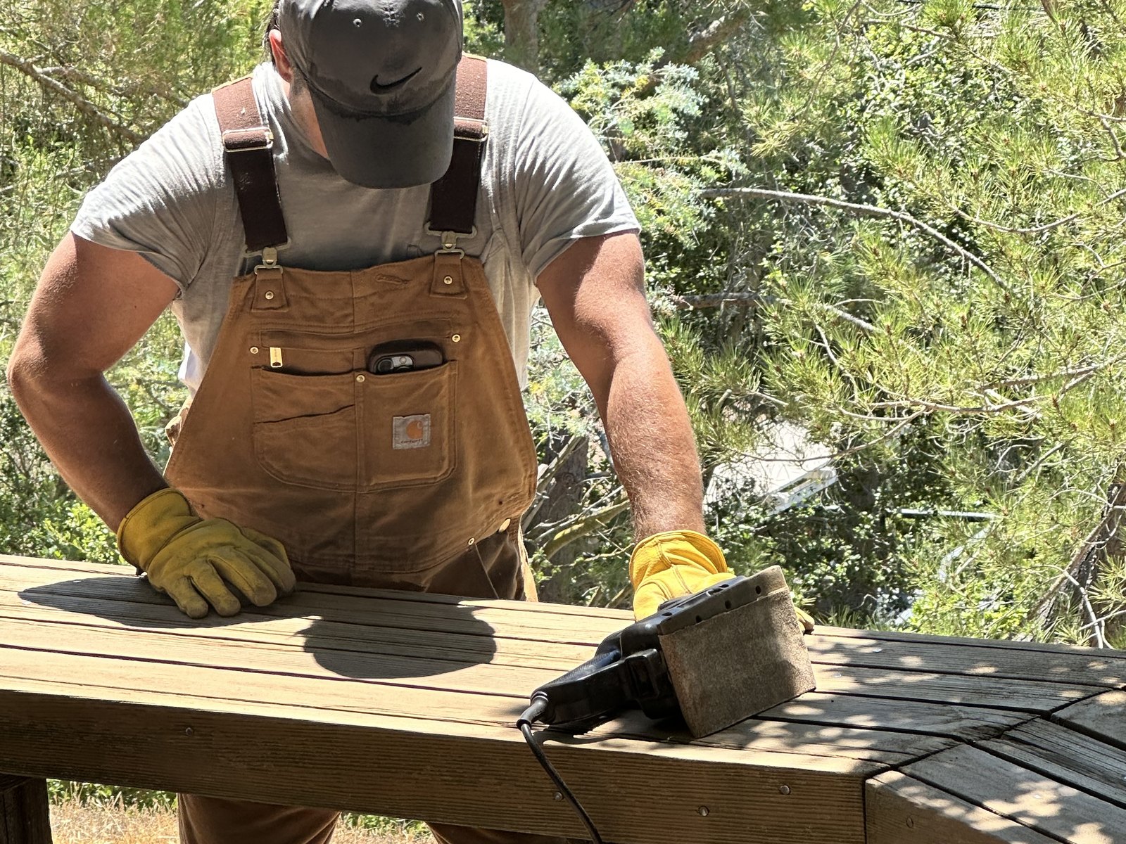 Big Iron crew member performing exterior carpentry work on a residential structure